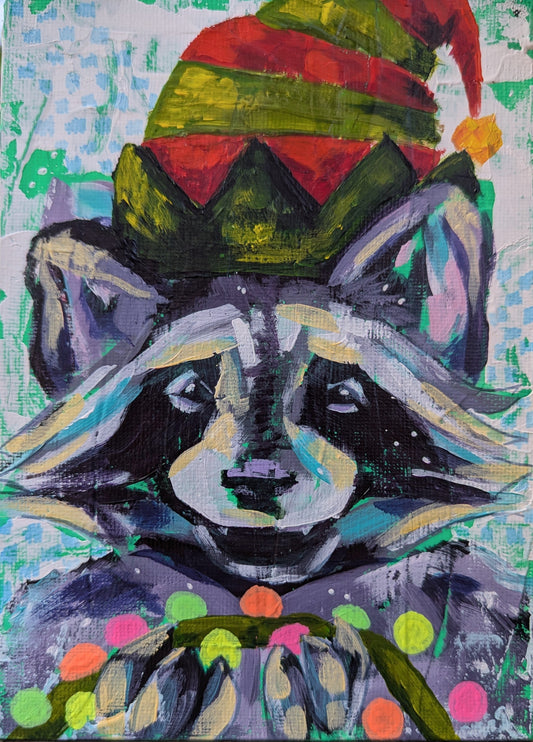 painting of an eager raccoon wearing an elf hat, smiling while holding up a string of Christmas lights. 