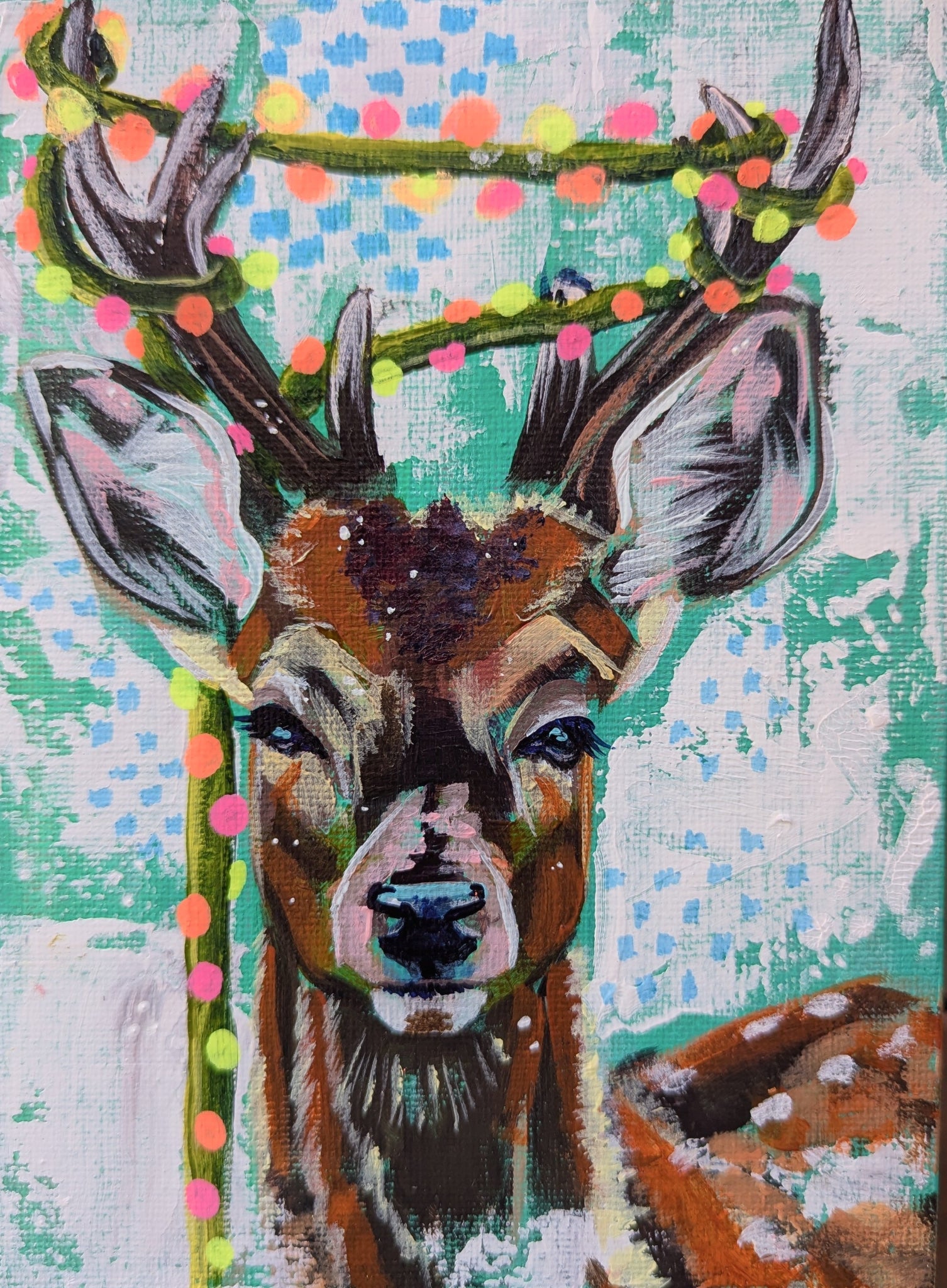 portrait painting of a young buck with Christmas lights draped around it's antlers on a teal and white background